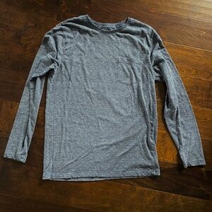 Blue striped crew neck long sleeve shirt with front pocket